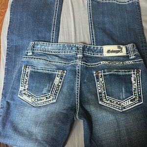 Embellished Blue Jeans by [rock and roll cowgirl jeans size 29/34]